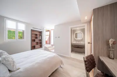 a white bedroom with a bed and a sink at REF 1923 - Cannes Vieux-Port 5-star penthouse for rent sea view in Cannes