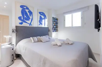 a bedroom with a bed with two towels on it at Palais Des Iles 2 by Halldis in Cannes