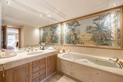 a bathroom with a large tub and a sink at REF 823 - Cannes Center - Duplex apartment for rent in Cannes