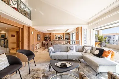 a living room with a couch and a table at REF 823 - Cannes Center - Duplex apartment for rent in Cannes
