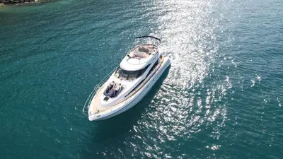 a boat in the water with people on it at Superbe yacht dans le port de Cannes in Cannes