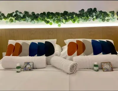a group of pillows on a table with pictures at T2 Vue Mer à Cannes in Cannes