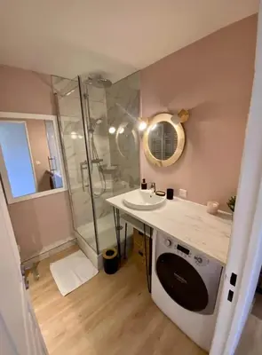 a bathroom with a sink and a shower at T2 Vue Mer à Cannes in Cannes