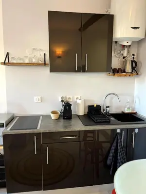 a kitchen with a sink and a counter top at Studio Suquet avec Parking in Cannes