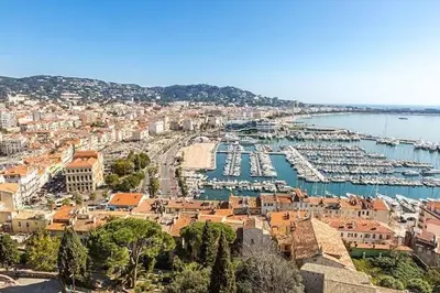 a city with a harbor with boats in the water at Studio Suquet avec Parking in Cannes