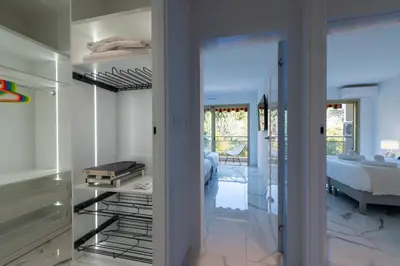 a room with a glass door leading to a bedroom at Spacious 2-Br Apartment in a Residence with Pool in Cannes
