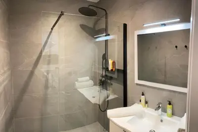 a bathroom with a shower and a sink at BEAUTIFUL 1 - BR APARTMENT - Next To Rue Antibes in Cannes