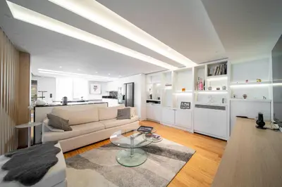 a living room with a couch and a table at REF 1985 - Cannes - Duplex for rent in Cannes