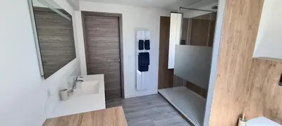 a bathroom with a white sink and a mirror at Villa Magenta in Cannes