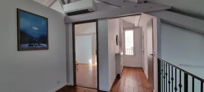 a hallway with a door leading into a room at Villa Magenta in Cannes