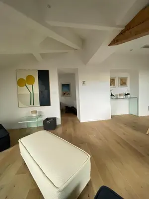 a living room with a white couch and a table at Beautiful modern apartment in Cannes in Cannes