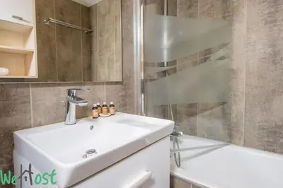 a bathroom with a sink and a shower at Studio - Palais des Festivals in Cannes