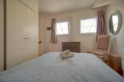 a bedroom with a bed with a stuffed animal on it at Edouard - Piscine-Parking - VCA in Cannes