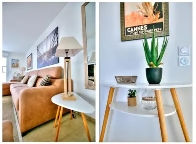 a living room with a couch and a table with a plant at superbe 3 chambres proche palais et croisette dag13 in Cannes