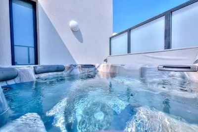 a large swimming pool in a room with windows at superbe 3 chambres proche palais et croisette dag13 in Cannes