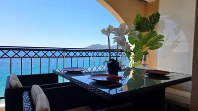 a dining table with a view of the ocean at Le Cannes Beach 799 - terrasse vue mer panoramique in Cannes