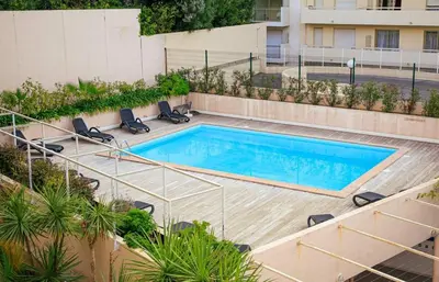 an image of a swimming pool on a building at RIO - 200 m plages - App 6pers- climatisé, terrasse, piscine, parking in Cannes