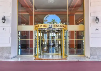 a entrance to a building with a revolving door at MIRAMAR-Studio tout confort sur la croisette in Cannes