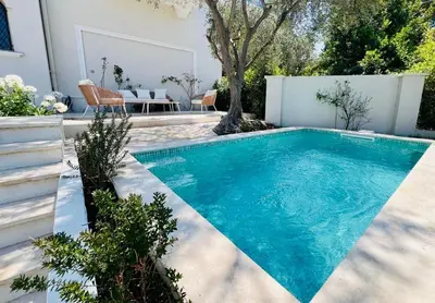 a swimming pool in the backyard of a house at Luxury Cannes Film Festival Townhouse 3 Bedrooms Private Pool & Terrace in Cannes