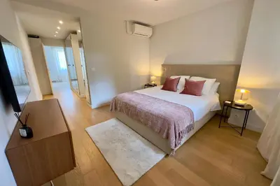 a bedroom with a bed and a glass table at Luxury Cannes Film Festival Townhouse 3 Bedrooms Private Pool & Terrace in Cannes