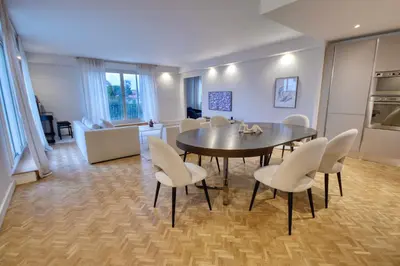 a kitchen and dining room with a table and chairs at Luxury Cannes Film Festival Townhouse 3 Bedrooms Private Pool & Terrace in Cannes