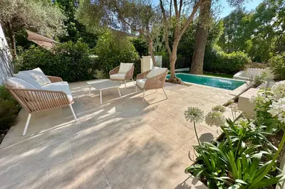 a white bedroom with a bed and a window at Luxury Cannes Film Festival Townhouse 3 Bedrooms Private Pool & Terrace in Cannes
