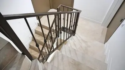 a staircase with black railings in a house at Proche Carlton & Croisette, Appartement 202 - Palmazur Vacances in Cannes