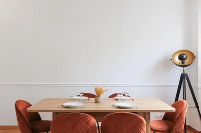 a dining room table with chairs and a camera at L'Azuréa - Centre - Plage - Wifi - Climatisation in Cannes