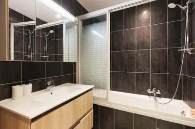 a bathroom with a sink and a shower and a tub at L'Azuréa - Centre - Plage - Wifi - Climatisation in Cannes