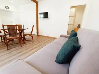 a living room with a couch and a table at Viva Riviera 6 Rue Commandant André in Cannes