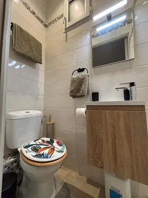 a bathroom with a toilet and a sink at Cosy Apartment in Cannes, AC, WiFi, 15min Palais in Cannes