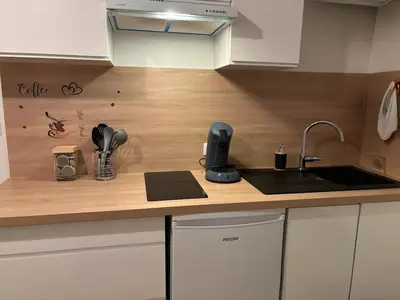 a kitchen with a sink and a counter top at Cosy Apartment in Cannes, AC, WiFi, 15min Palais in Cannes