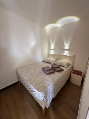 a bedroom with a bed with two towels on it at Sisley 1061 - F2 Terrasse avec vue mer in Cannes