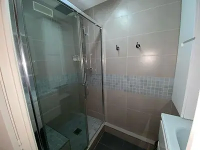 a bathroom with a glass shower with a sink at Spacieux 3 chambres BALCON, MARTINEZ -CARLTON A3B130 in Cannes