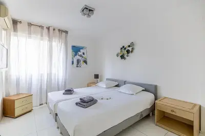 a bedroom with two beds with towels on them at Spacieux 3 chambres BALCON, MARTINEZ -CARLTON A3B130 in Cannes