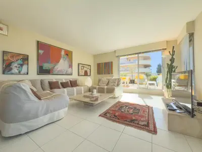 a living room with a couch and a table at The Artist by Winsome Destination in Cannes