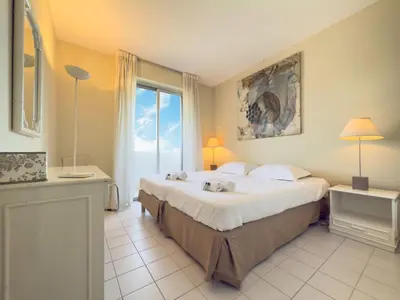 a bedroom with a bed with two stuffed animals on it at The Artist by Winsome Destination in Cannes