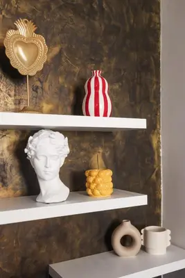 two white shelves with vases and a statue on them at La Dolce Vita T2 au calme plein coeur de Cannes in Cannes