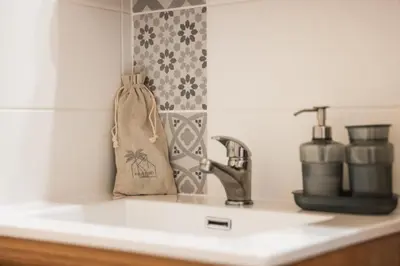 a kitchen counter top with a sink and a sink at La Dolce Vita T2 au calme plein coeur de Cannes in Cannes