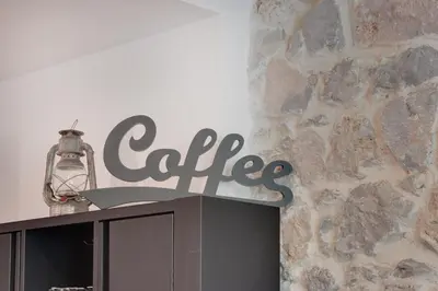 a sign that says coffee on top of a cabinet at À 1km Plage du Midi et Palais des Festivals - Appartement Centre Cannes avec Cour Extérieur Privée in Cannes
