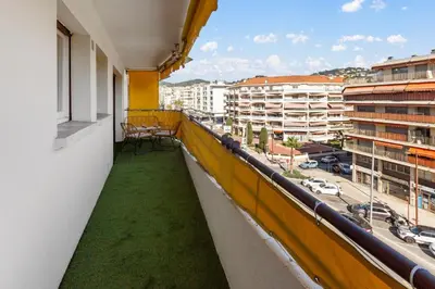 a balcony with a view of a city at Le Chambord - Hypercentre - Spacious - Terrace in Le Cannet