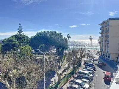 a parking lot with cars parked next to a building at Emplacement idéal, terrasse vue mer 321L SEB in Cannes