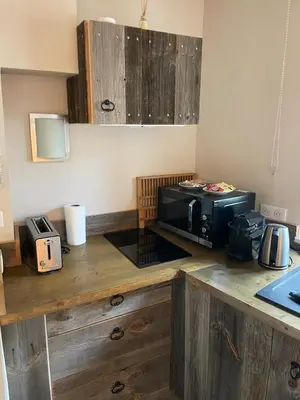 a kitchen with a counter top with a microwave at Cannes historic center in Cannes