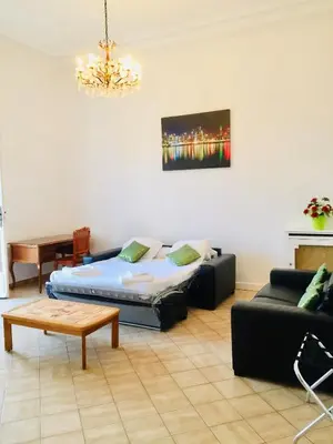 a living room with a bed and a couch at Winter Palace in Cannes