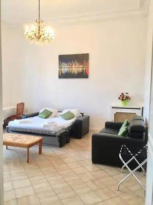 a living room with a couch and a table at Winter Palace in Cannes