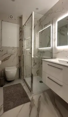 a bathroom with a shower and a toilet and a sink at Cozy studio in the heart of Cannes in Cannes