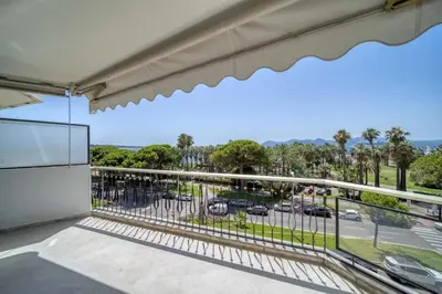 a balcony with a view of a parking lot at REF 2012 - Cannes Croisette - Apartment to rent sea view in Cannes
