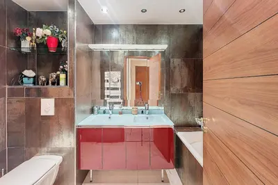 a bathroom with a red sink and a toilet at HENRI CAMILLE REAL ESTATE - Kent - Huge 2 bedrooms appt - 5 min Croisette in Cannes