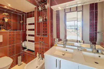 a bathroom with a sink and a toilet and a window at HENRI CAMILLE REAL ESTATE - Kent - Huge 2 bedrooms appt - 5 min Croisette in Cannes