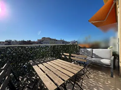 a wooden bench sitting on top of a roof at Les Venitiennes in Cannes